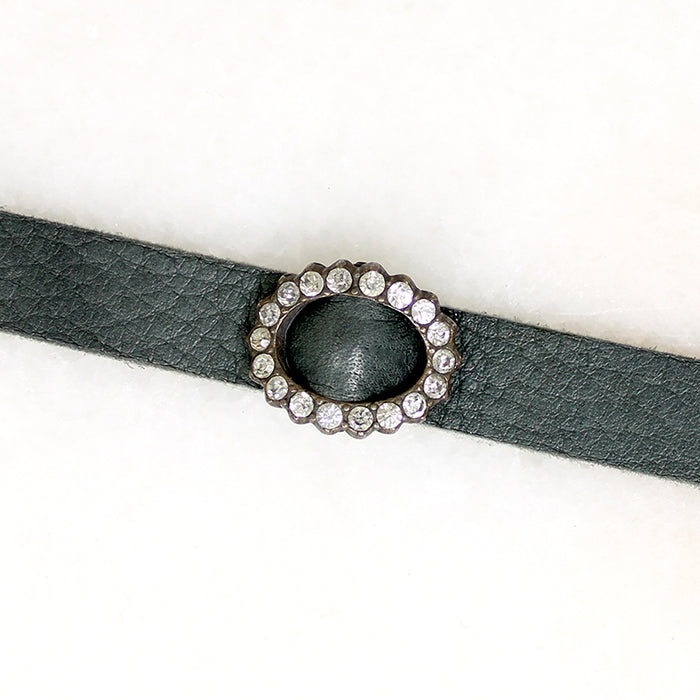 Title
Green Leather & Paste Buckle Bracelet by Ancient Influences
