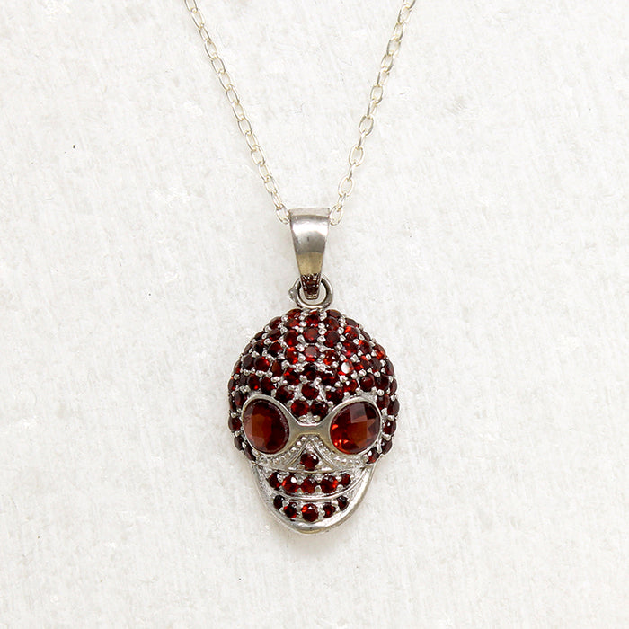 Garnet Studded Sterling Silver Artisan Skull Pendant