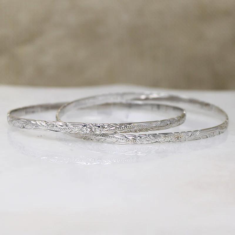 Two Slim Sterling Bangles with Hawaiian Pua Kala Flowers