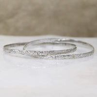 Two Slim Sterling Bangles with Hawaiian Pua Kala Flowers