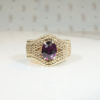 Beautifully Woven Gold Ring with Garnet