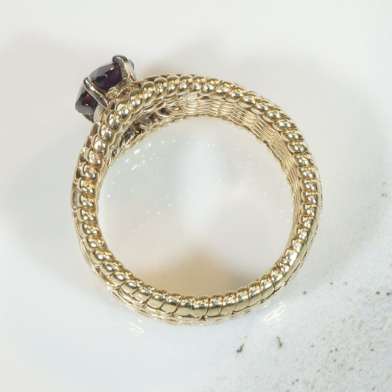 Beautifully Woven Gold Ring with Garnet