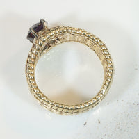 Beautifully Woven Gold Ring with Garnet