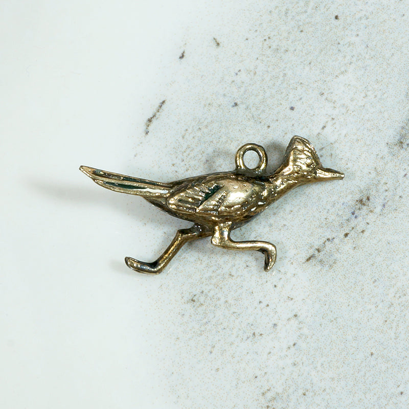 I'm a 9k Gold Roadrunner Charm Honey