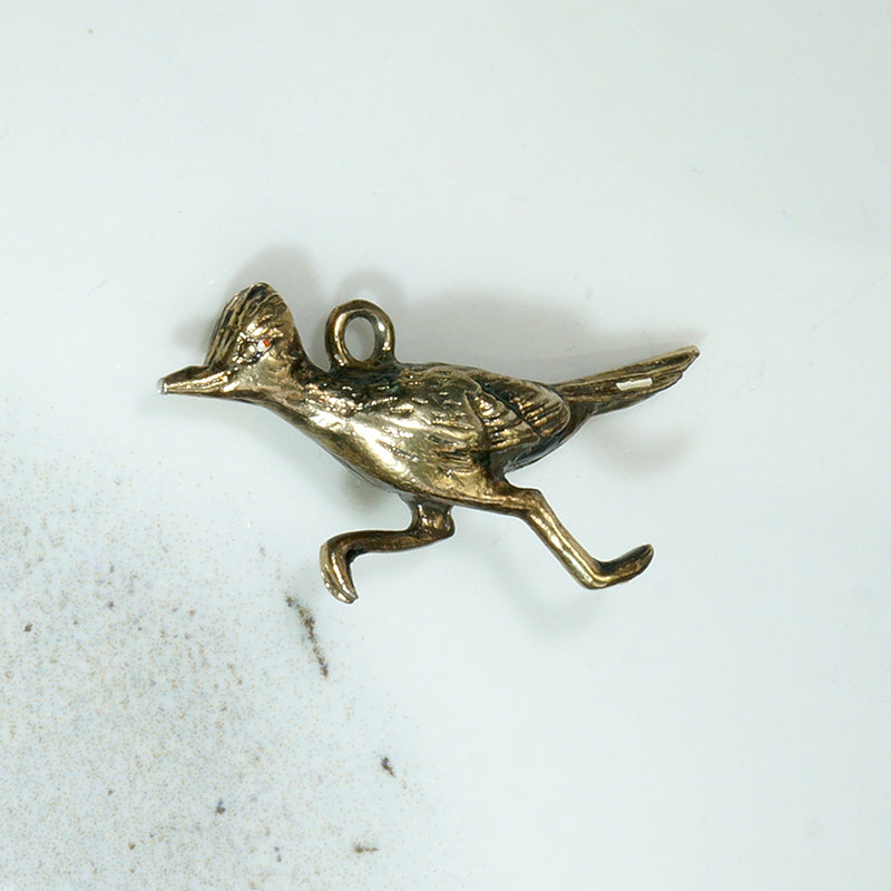 I'm a 9k Gold Roadrunner Charm Honey