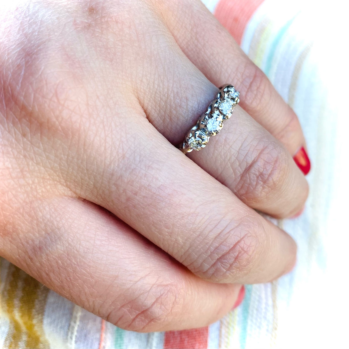 Four Diamonds in Curvaceous White Gold Band