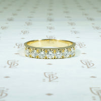 rich 18k yellow gold band set with 3/4 ct of round diamonds