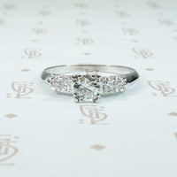 pretty 1940's knife edge platinum diamond engagement ring with side diamonds