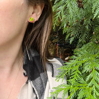 Glowing Green Peridot Studs in Gold Martini Settings