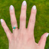Jaunty Emerald Ring with Dazzling Diamond Accents