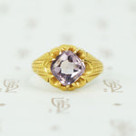 buff top amethyst set in 22k yellow gold belcher setting circa 1890