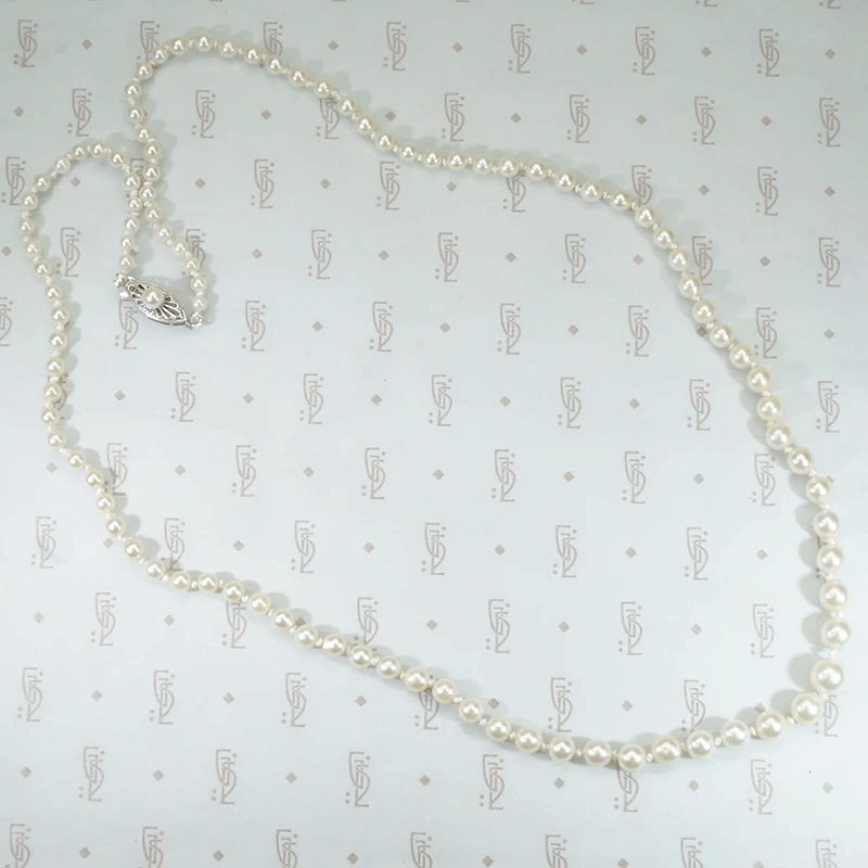 14k white gold filigree clasp 24" long strand of graduated pearls