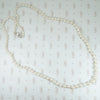 14k white gold filigree clasp 24" long strand of graduated pearls