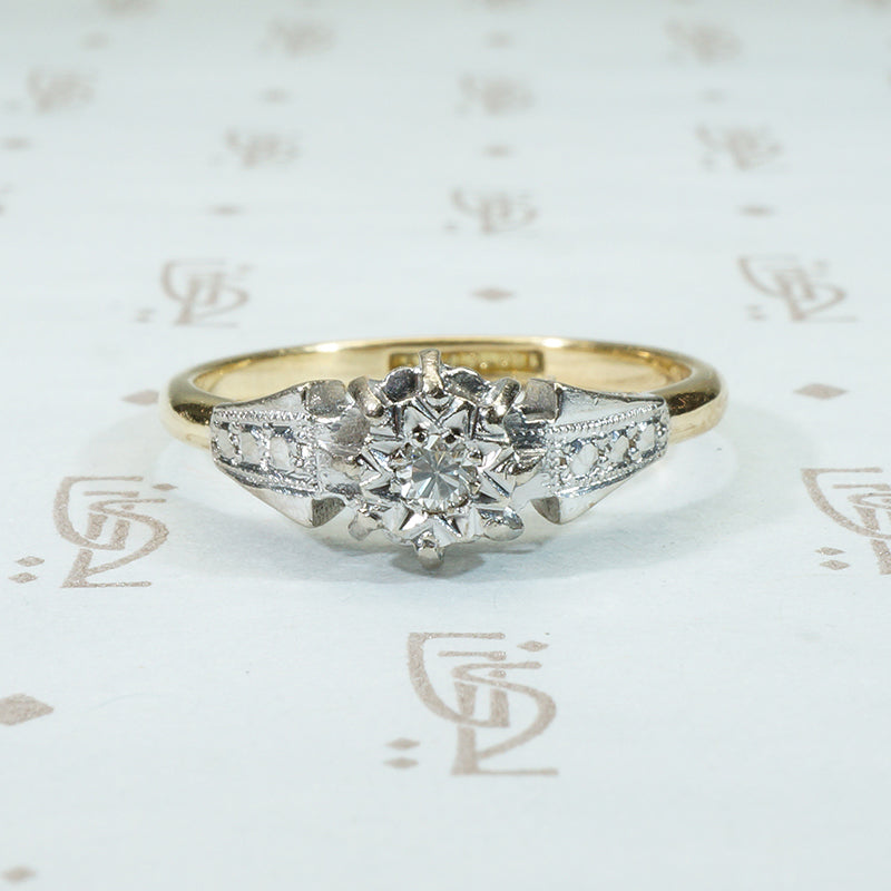 platinum on 18k yellow gold with a diamond star set into the top of this engagement ring