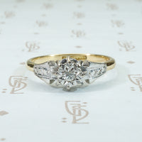 platinum on 18k yellow gold with a diamond star set into the top of this engagement ring
