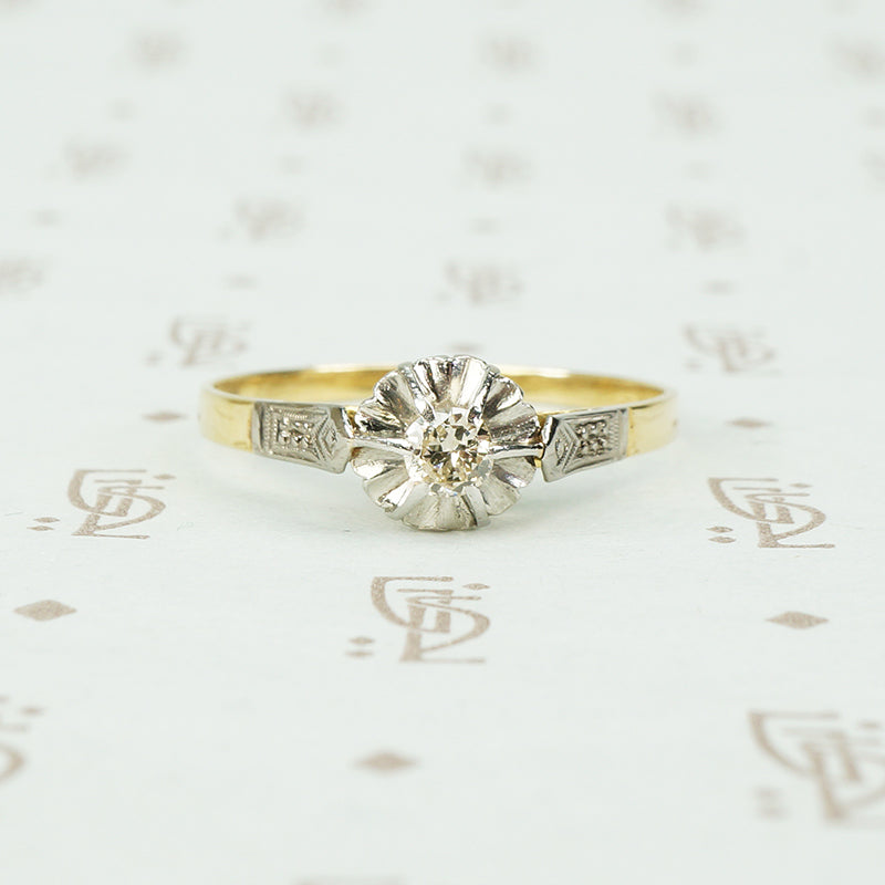 platinum and 18k yellow gold engagement ring with fluted head