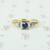2 tone white and yellow gold 1940's engagement ring with sapphire and side diamonds
