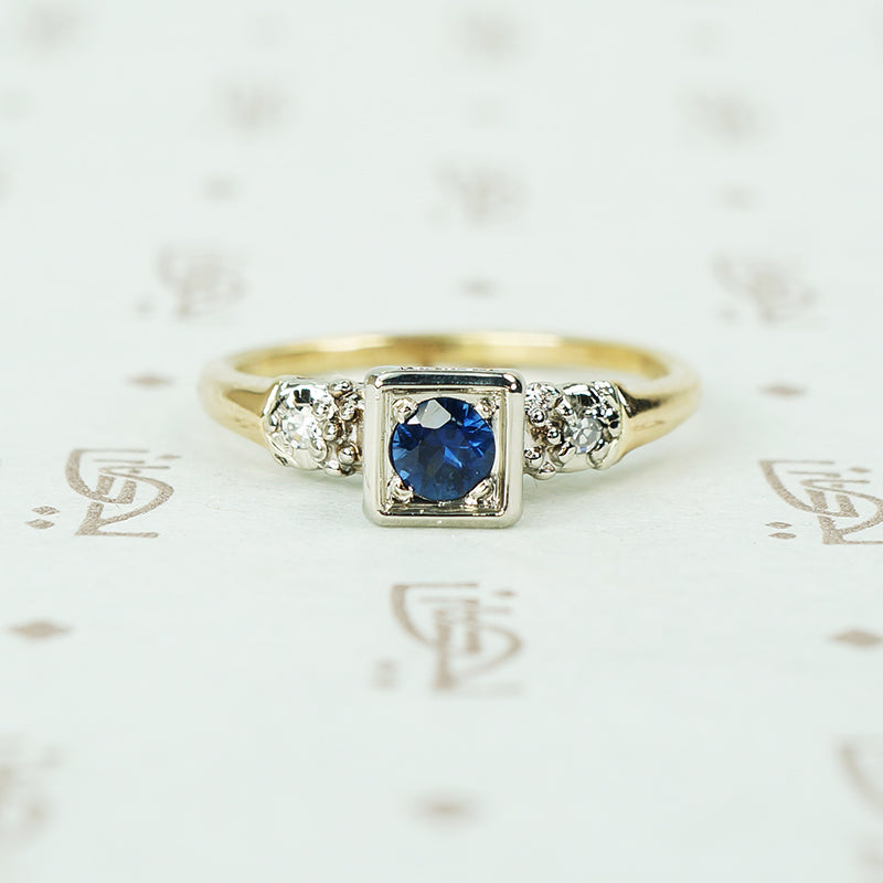 2 tone white and yellow gold 1940's engagement ring with sapphire and side diamonds