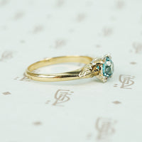 1/2 carat natural blue zircon in 2 tone 14k gold setting vintage engagement ring side view