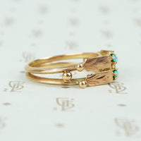 rose gold turquoise ring vintage with 2 turquoise rounds and engraved panels side view of double band