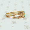 rose gold turquoise ring vintage with 2 turquoise rounds and engraved panels side view of double band