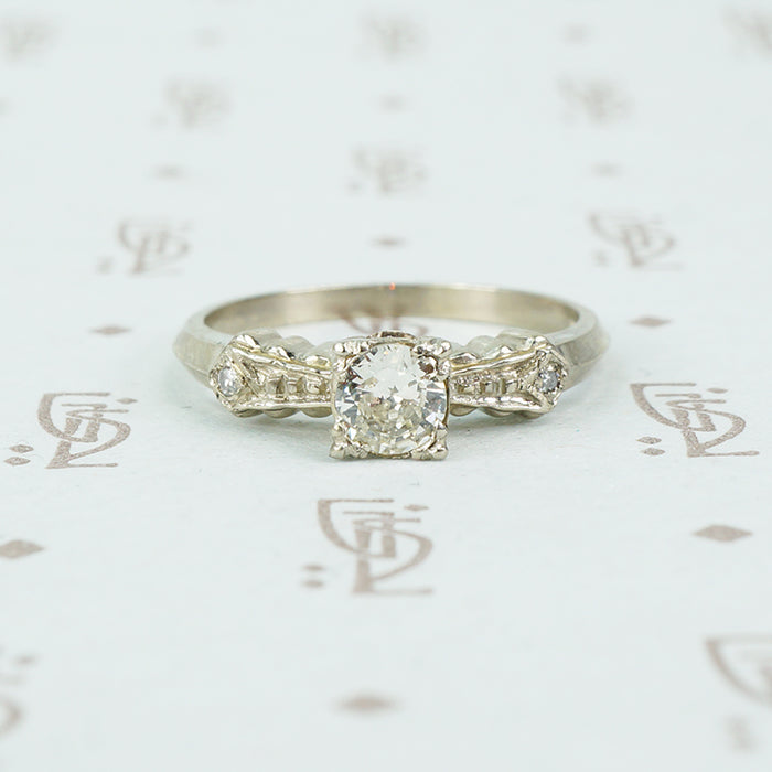1940's white gold bow tie diamond engagement ring side view