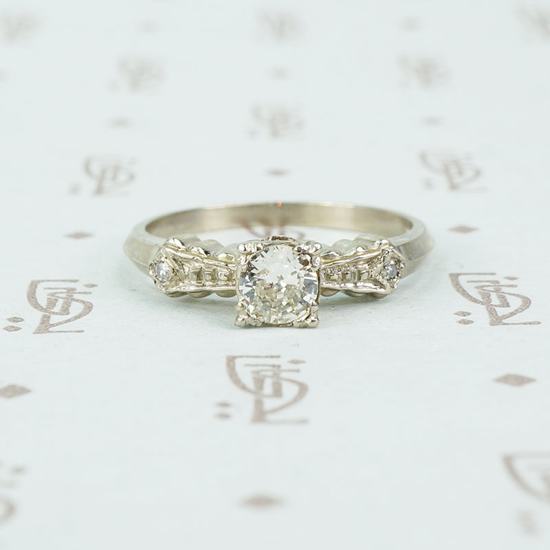 1940's white gold bow tie diamond engagement ring side view