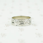wide white gold band with forget me nots