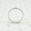 wide white gold band with forget me nots side view