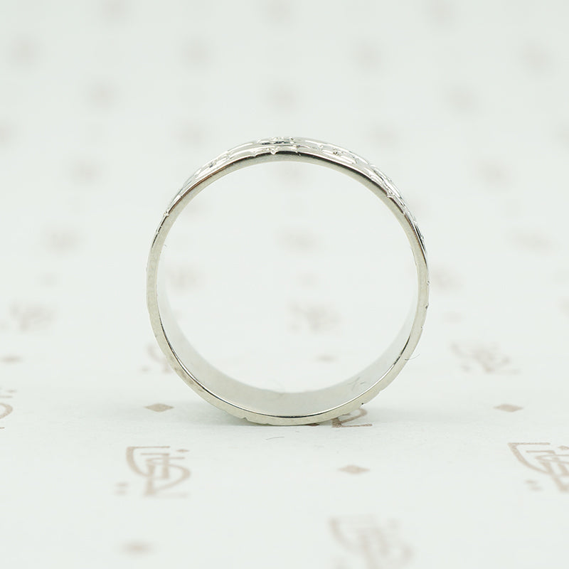 wide white gold band with forget me nots
