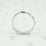 wide white gold band with forget me nots side view