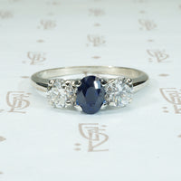 18k white gold sapphire and diamond 3 stone ring