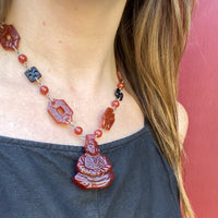 Dramatic Pressed Glass Buddha Necklace