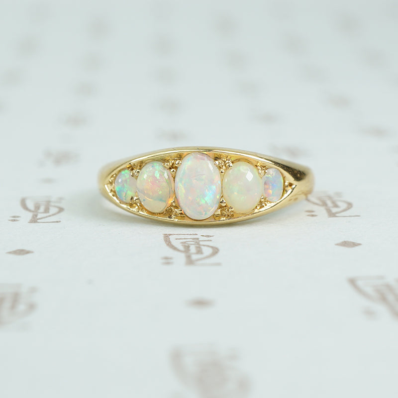 5 graduated opals in 18k yellow gold