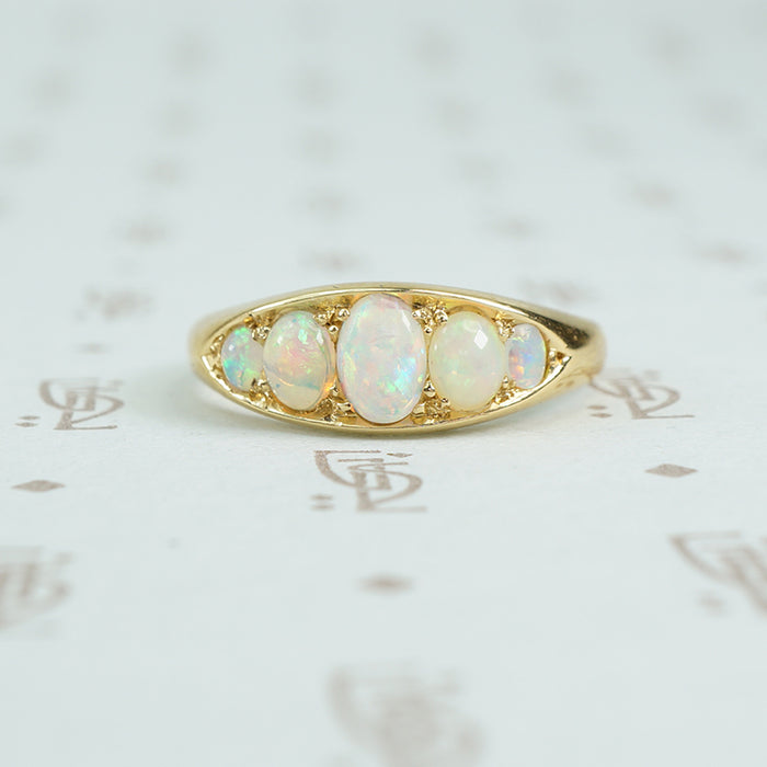 5 graduated opals in 18k yellow gold