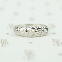 18k white gold 5 diamond band sculpted top set with omc diamonds