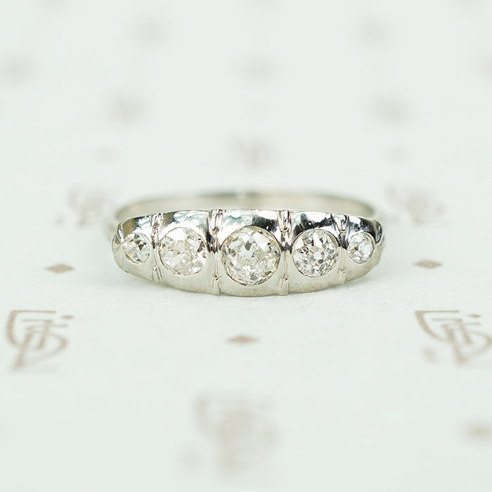 18k white gold 5 diamond band sculpted top set with omc diamonds