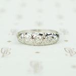 18k white gold 5 diamond band sculpted top set with omc diamonds