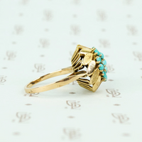 1960's 14k yellow gold and turquoise flower ring side view showing alternating brushed and shiny gold petals