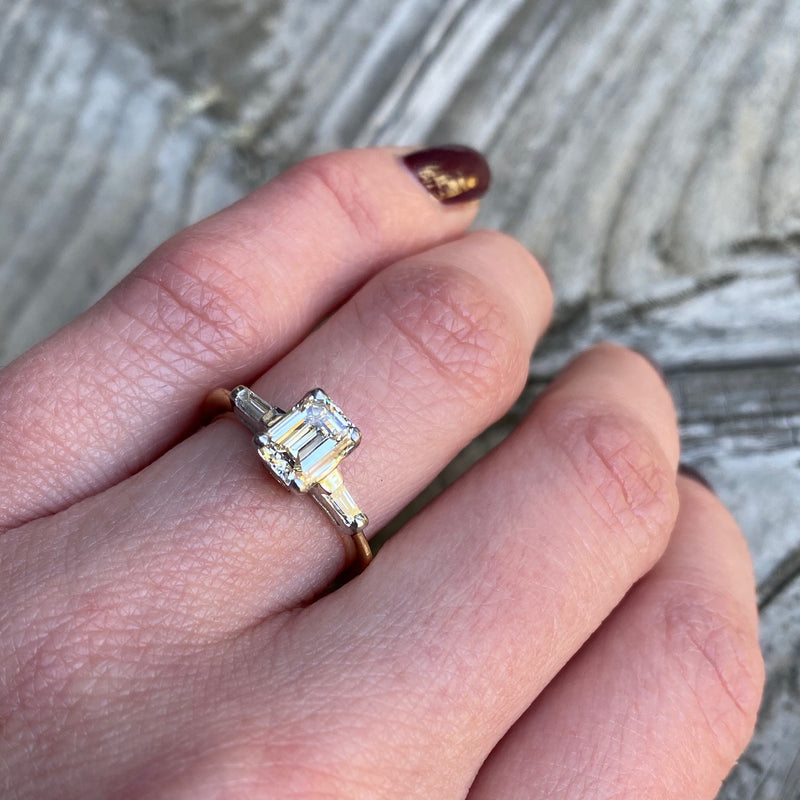 Classic and Unique Emerald Step Cut Diamond Ring