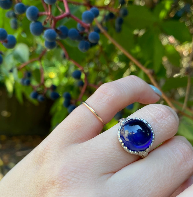 Magical Cabochon Sapphire in Crisp Floral Setting
