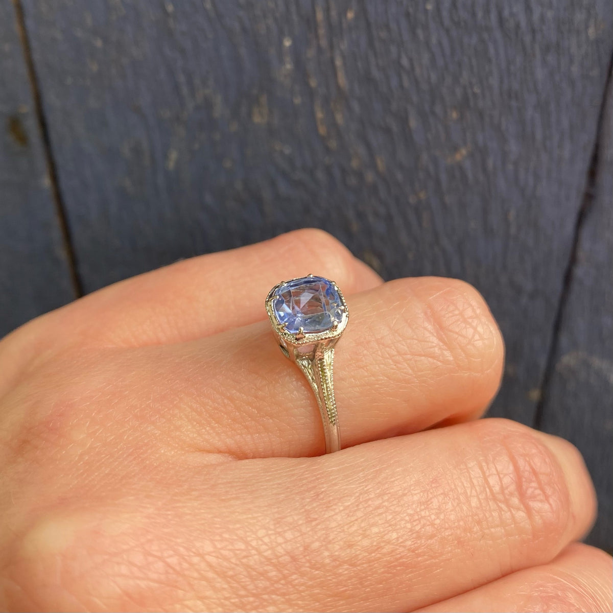 Engraved Platinum Solitaire Ring with Antique Sapphire