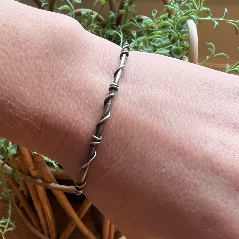 The Infinity Twist Silver Bangle from Allie B.