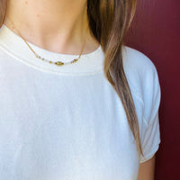 Turquoise & Brass Bead Arc Necklace by Brin