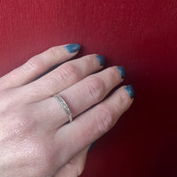 Crisp Seven Diamond & White Gold Wedding Band