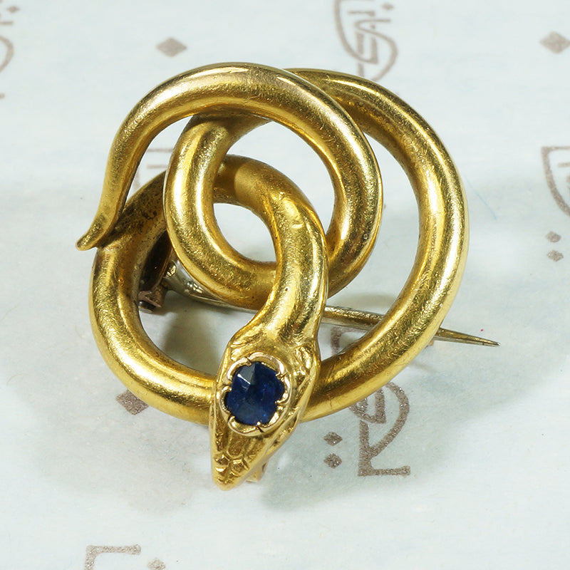 18k yellow gold french snake chatelete set with a sapphire