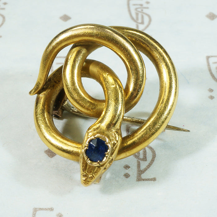 18k yellow gold french snake chatelete set with a sapphire