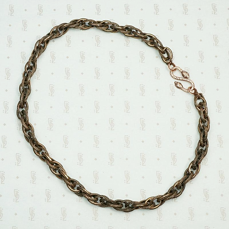 Triple twist copper chain with snake clasp.