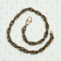 Triple twist copper chain with snake clasp.