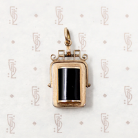 It spins in an ornate gold filled frame, perfect for fidgeting with. 